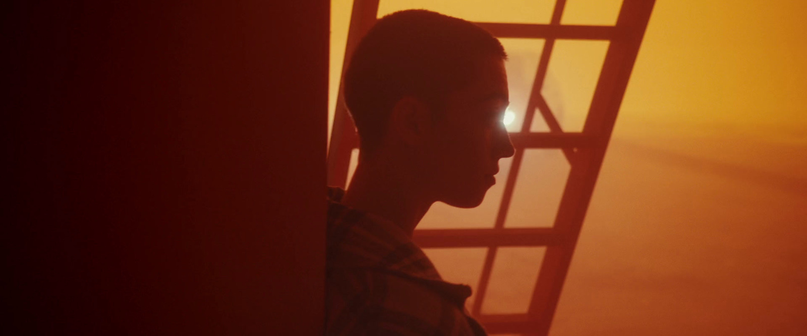 a man standing in front of a fire escape