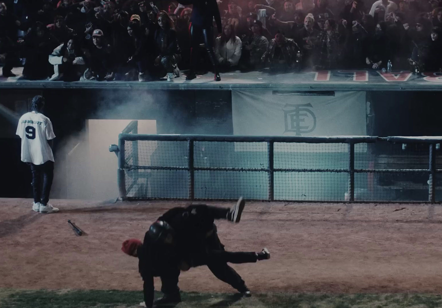 a baseball player holding a bat on top of a field