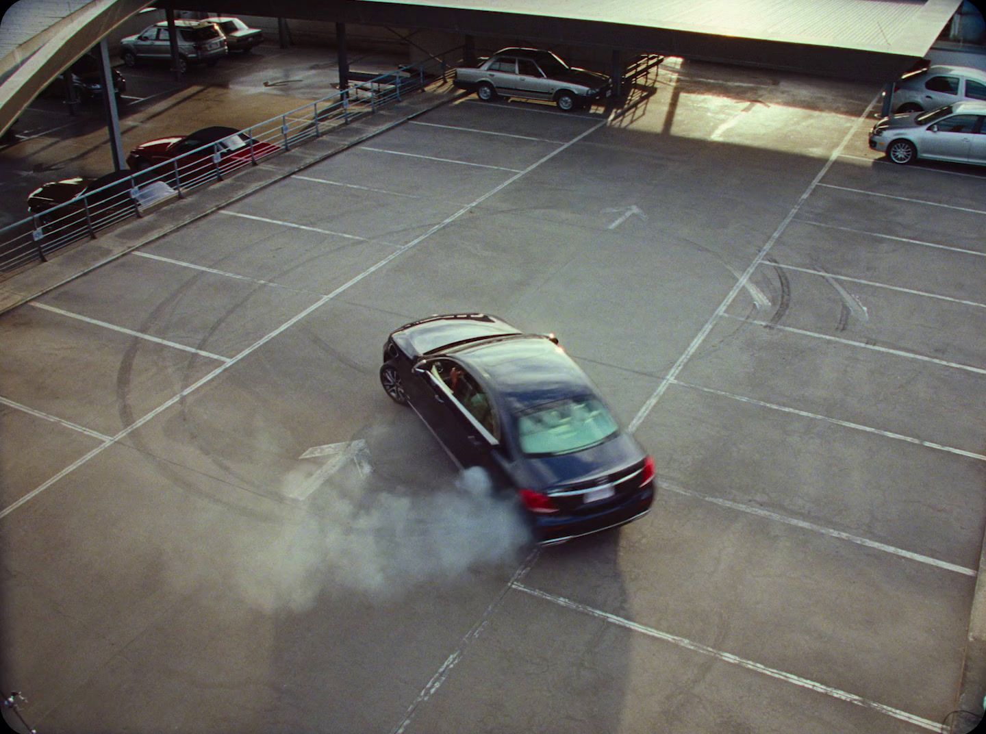 a car driving through an empty parking lot