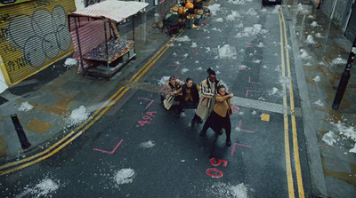 a group of people walking down a street