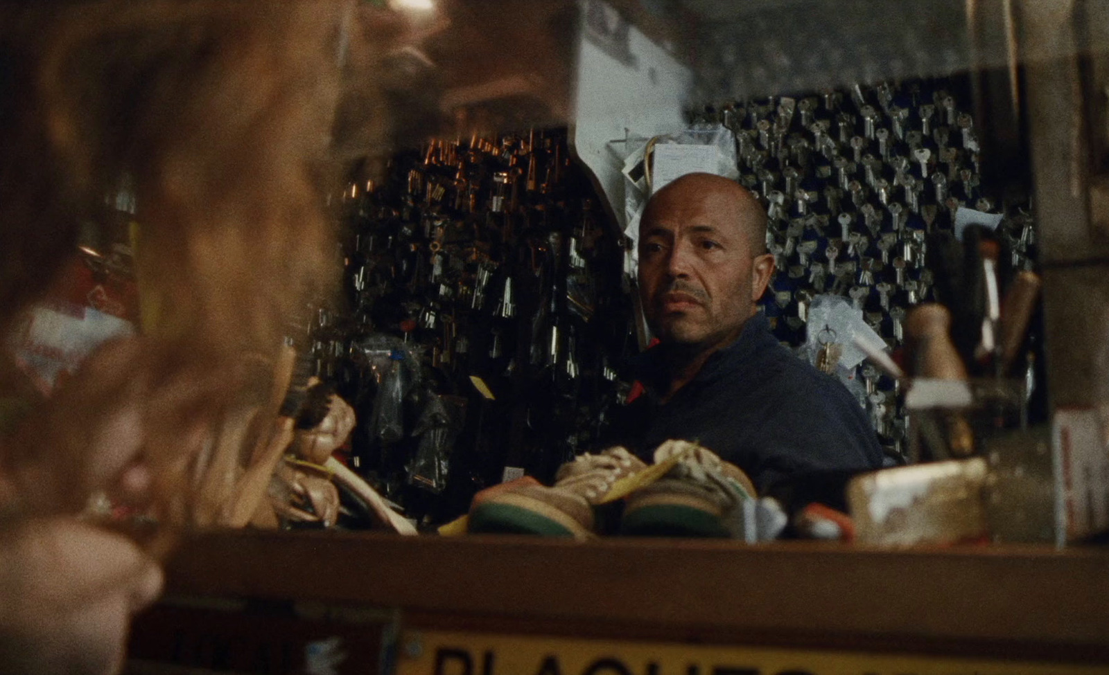 a man sitting at a counter in a store