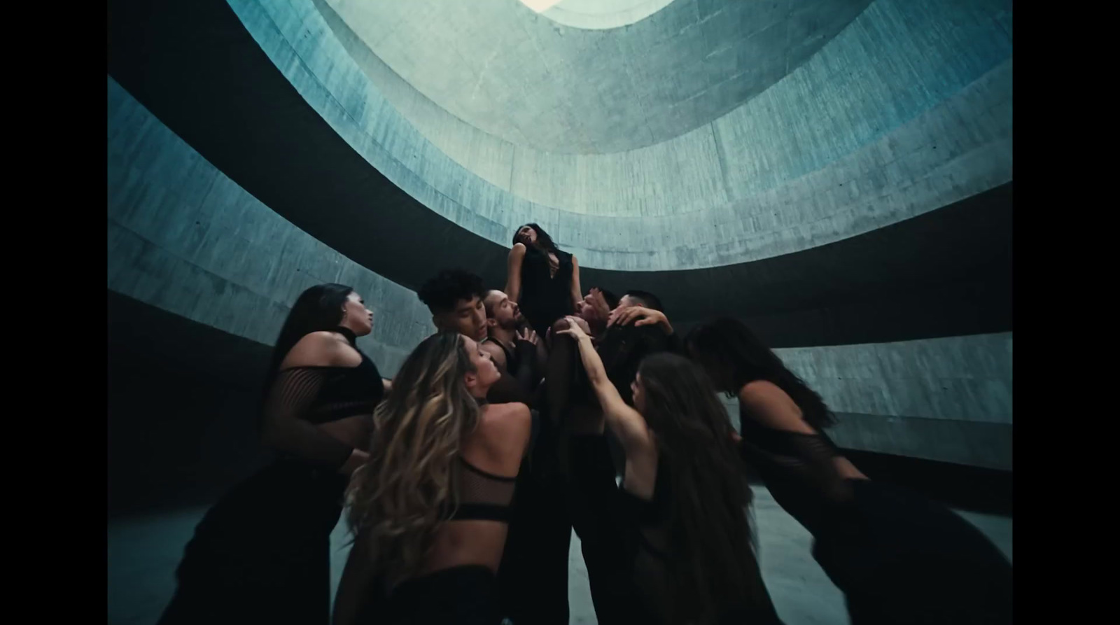 a group of women standing around each other