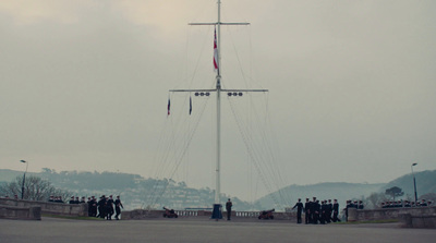 a group of people standing in front of a boat