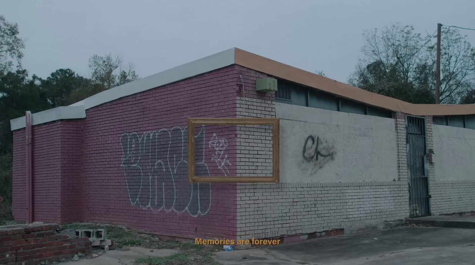 a brick building with graffiti on the side of it