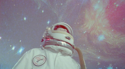 a man in a space suit with a gas mask on