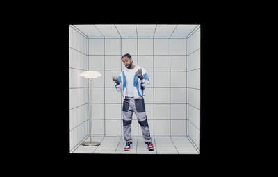 a man standing in a shower holding a blow dryer