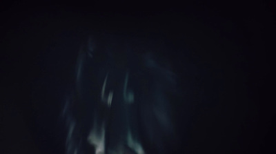 a blurry photo of a person in the dark