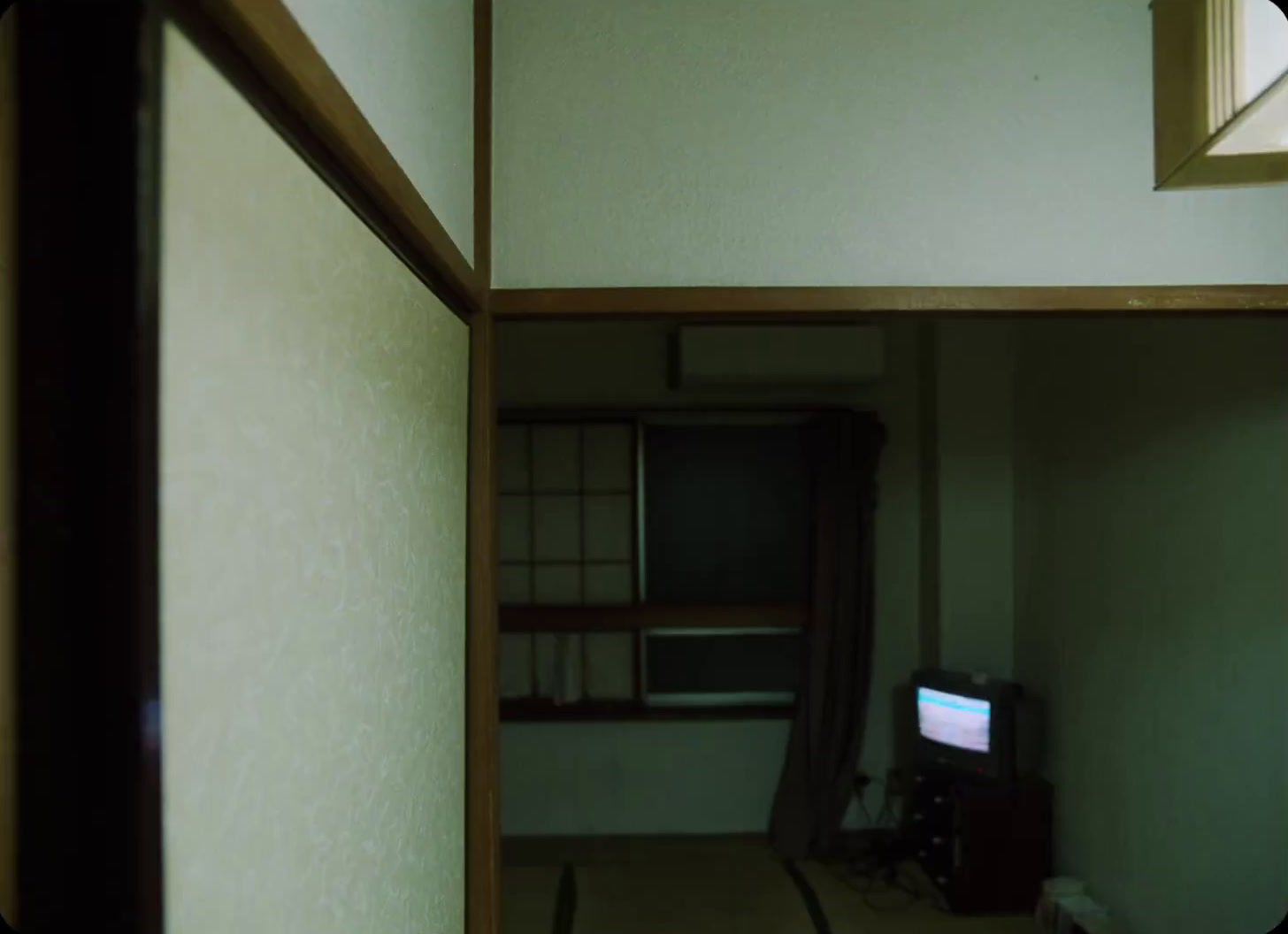 a room with a television and a window