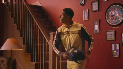 a man standing in front of a stair case