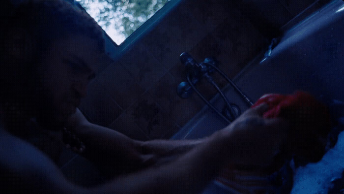 a man washing his hands in a sink