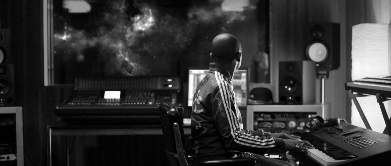 a man sitting at a desk with a keyboard