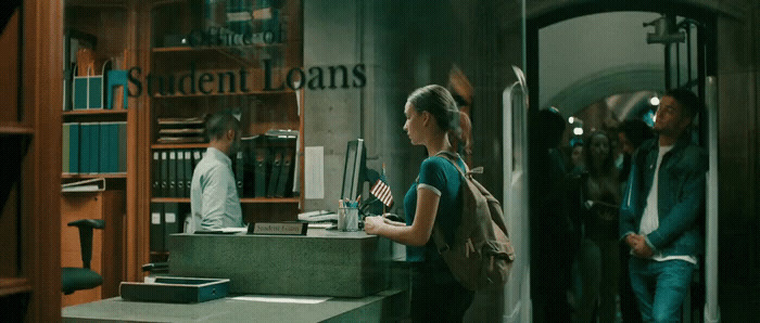 a woman standing in front of a book store