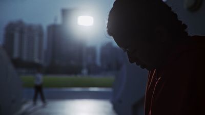 a man looking down at his cell phone