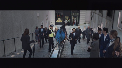 a group of people walking down a flight of stairs