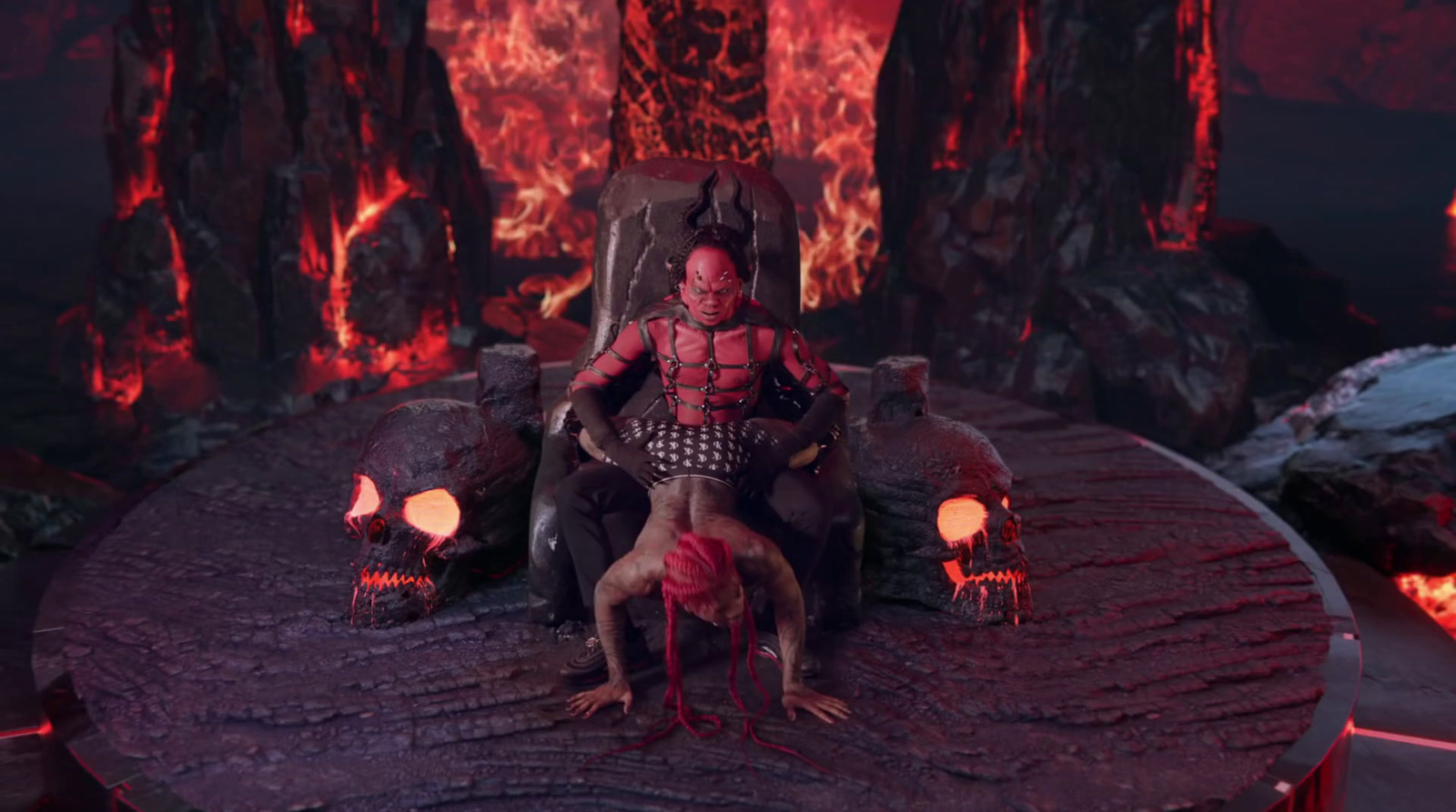 a man sitting on top of a chair in front of a fire