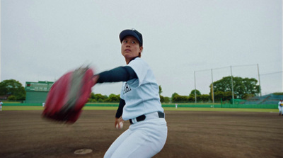 a baseball player throwing a ball on a field