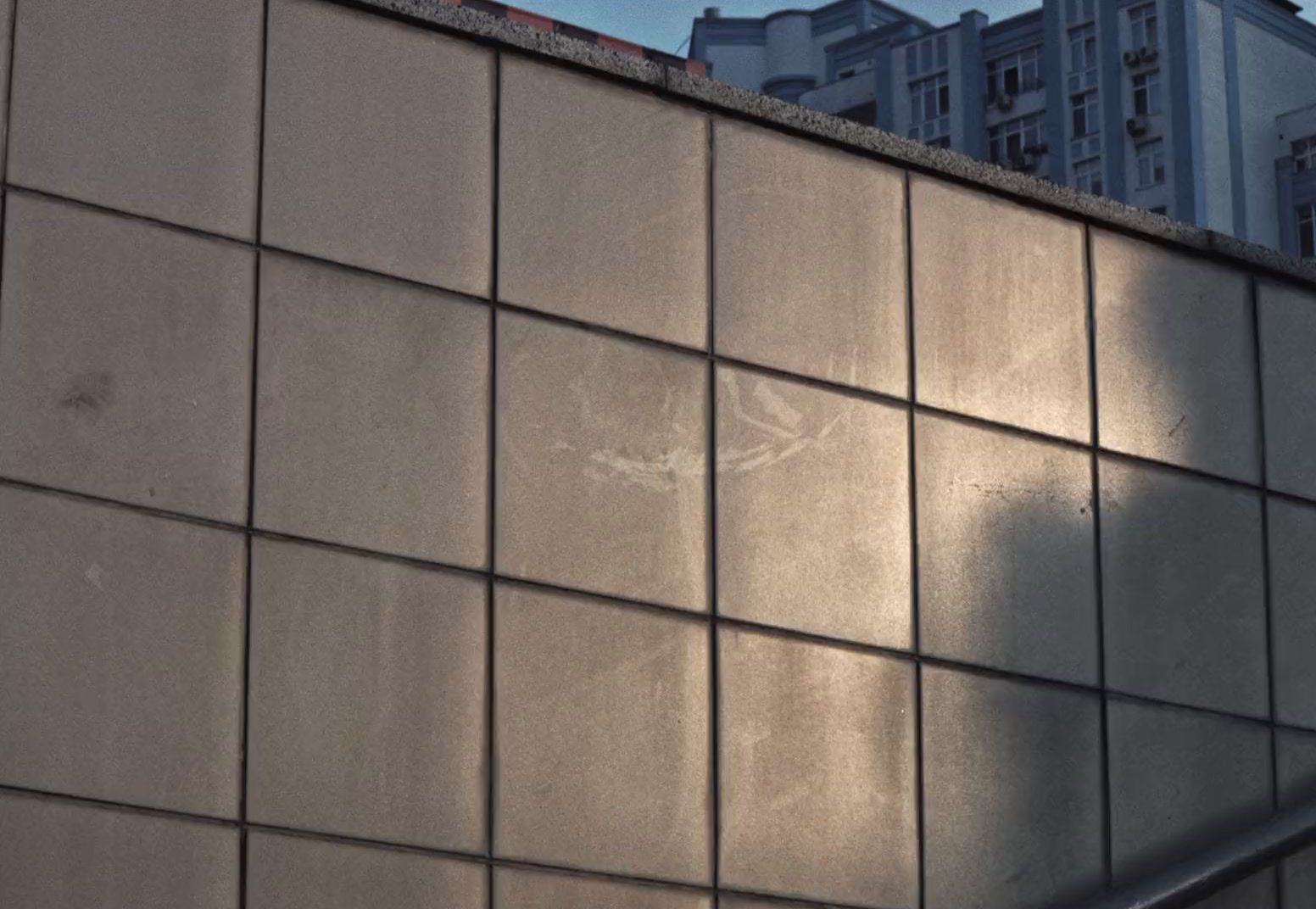 a building that has a metal hand rail on it