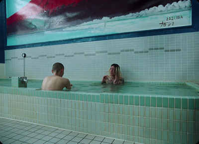 a man and a woman sitting in a bathtub