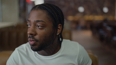 a close up of a person wearing a white shirt