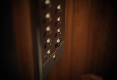 a close up of a wooden door with knobs