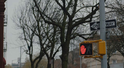 a traffic light that is red on a pole