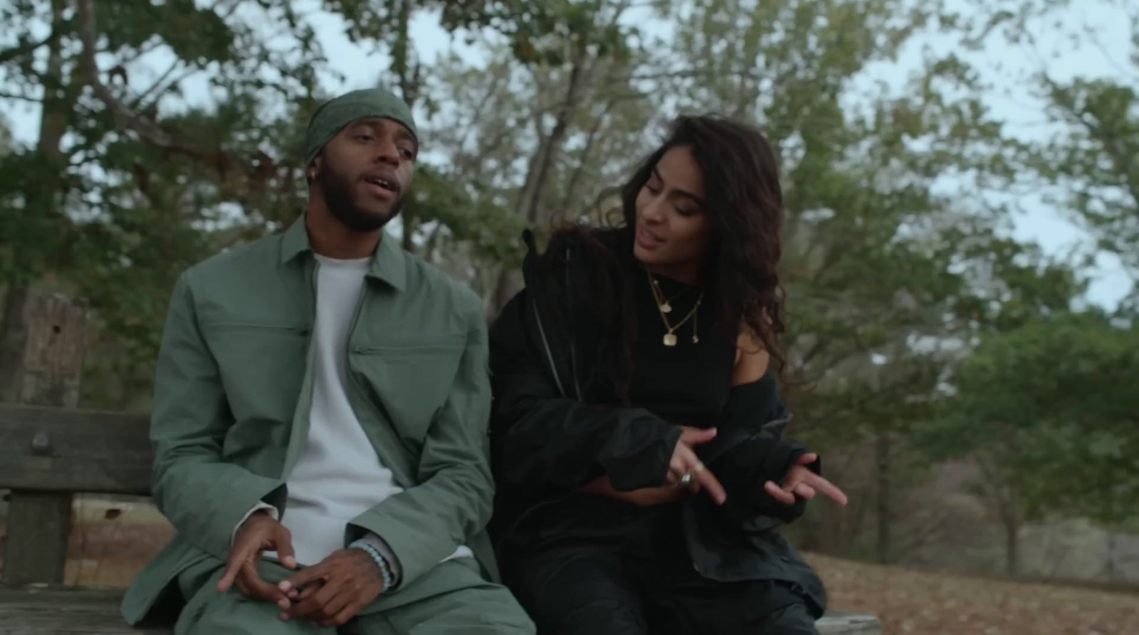 a man and a woman sitting on a bench