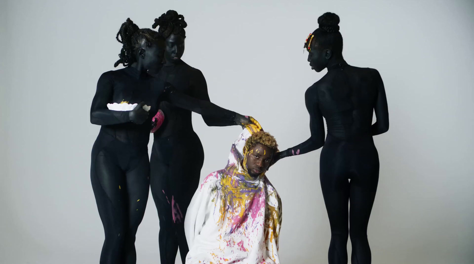 a group of three mannequins dressed in body paint