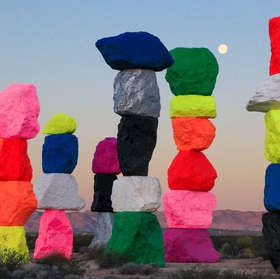 a group of rocks sitting in the middle of a desert