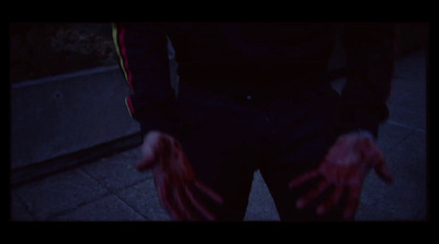 a person with their hands out in the dark