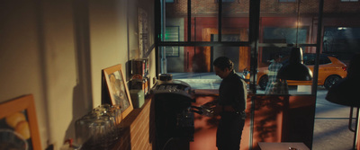 a man standing in front of a window in a room