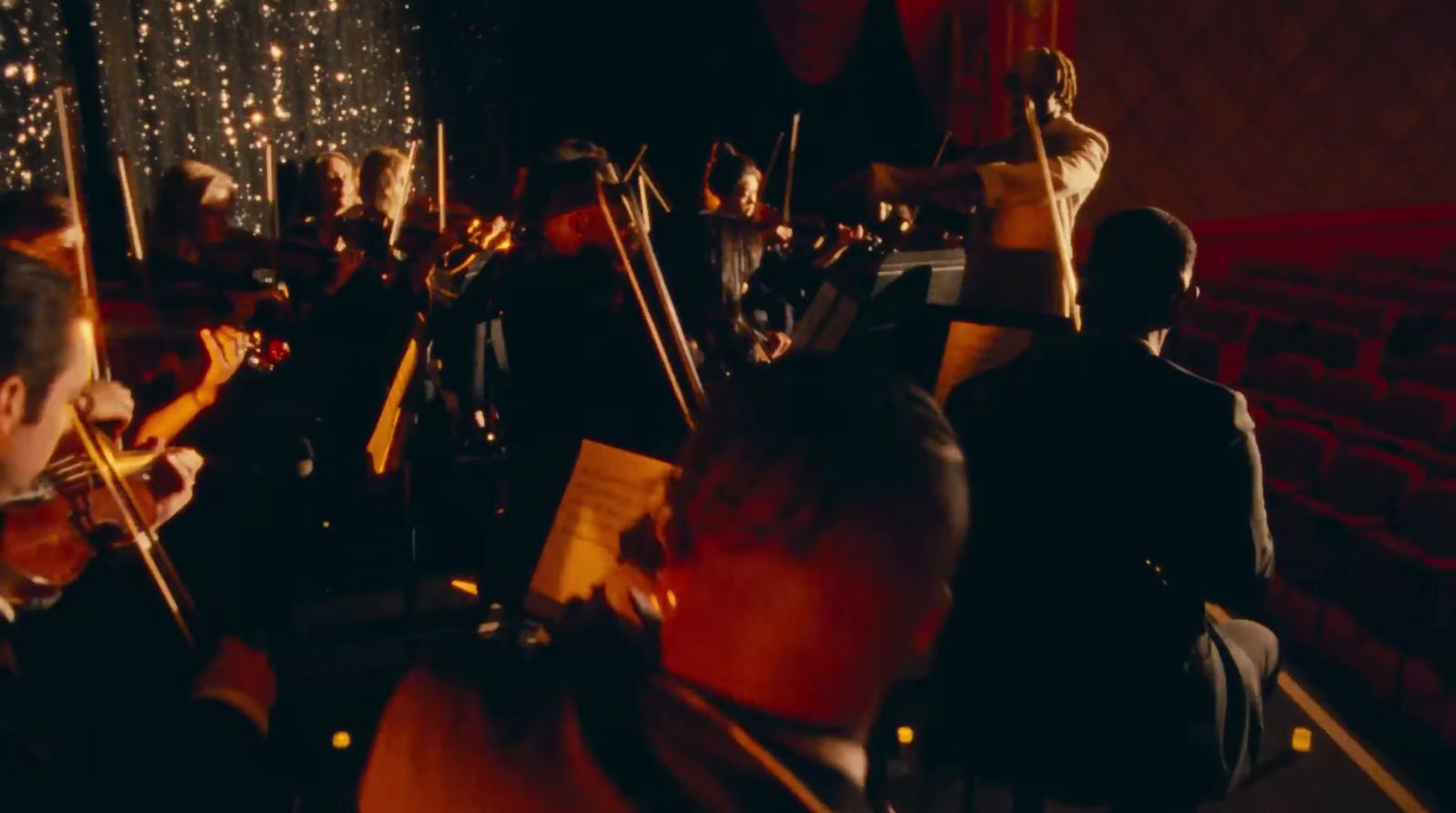 a group of people playing instruments in a room