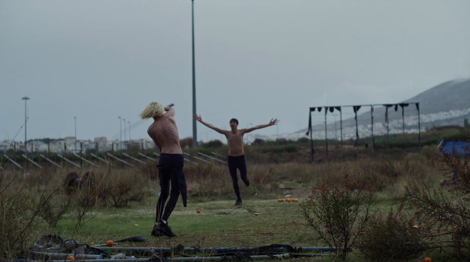 a couple of people that are standing in the grass