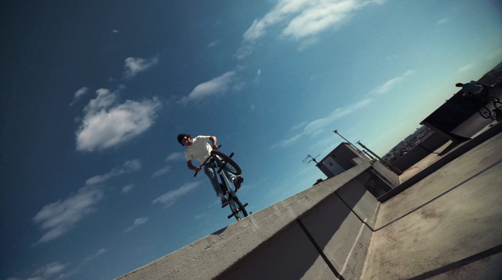 a man riding a skateboard up the side of a ramp