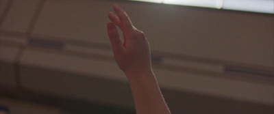 a person holding their hand up in the air