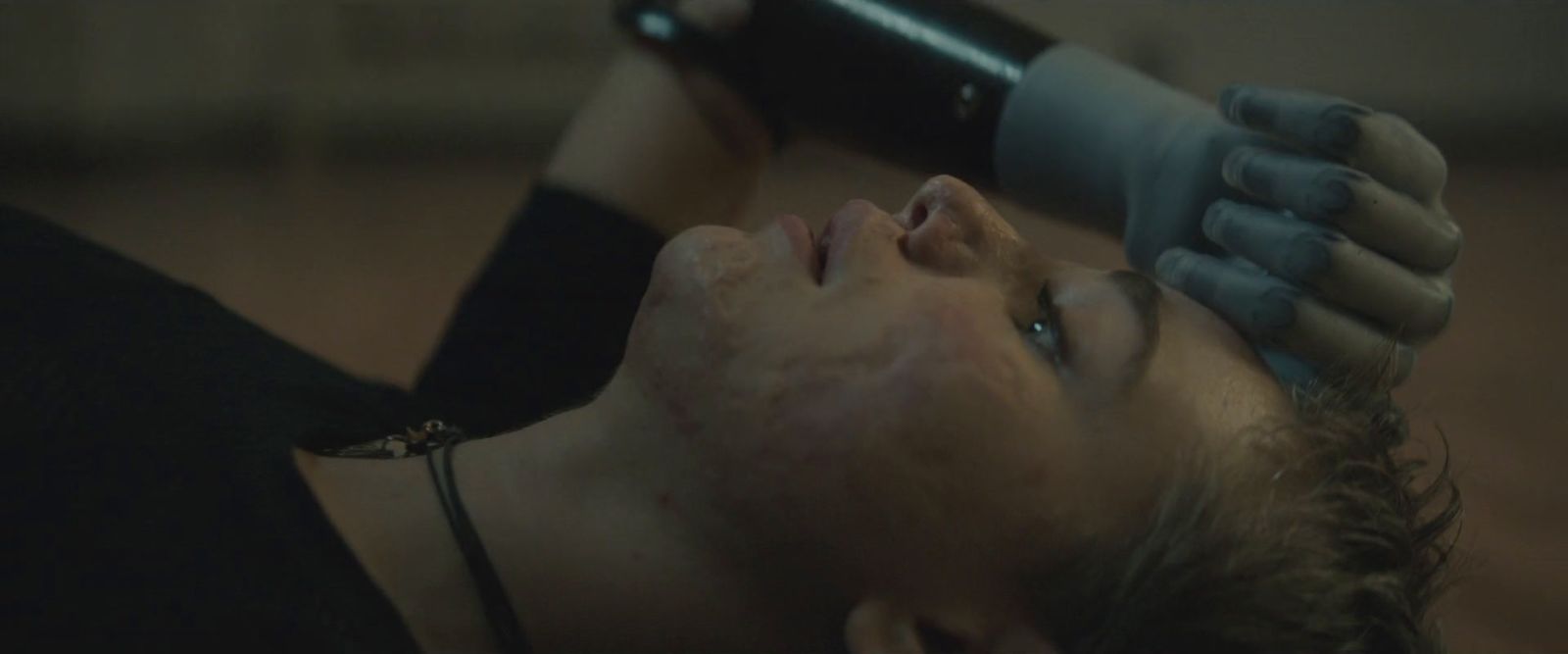 a woman getting her hair brushed by a hair dryer