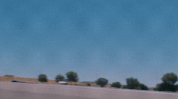 a person riding a skateboard on a city street