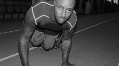 a man is doing push ups on a skateboard