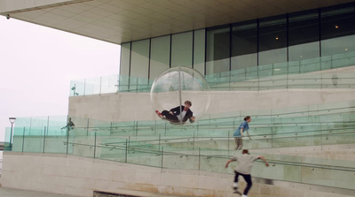 a man riding a skateboard down a set of stairs