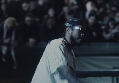 a baseball player holding a bat in front of a crowd