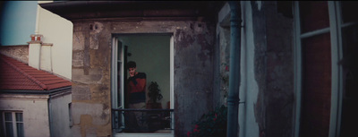 a person standing in a doorway of a building