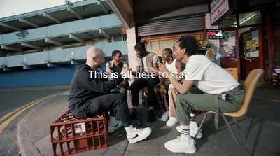 a group of people sitting on top of a bench