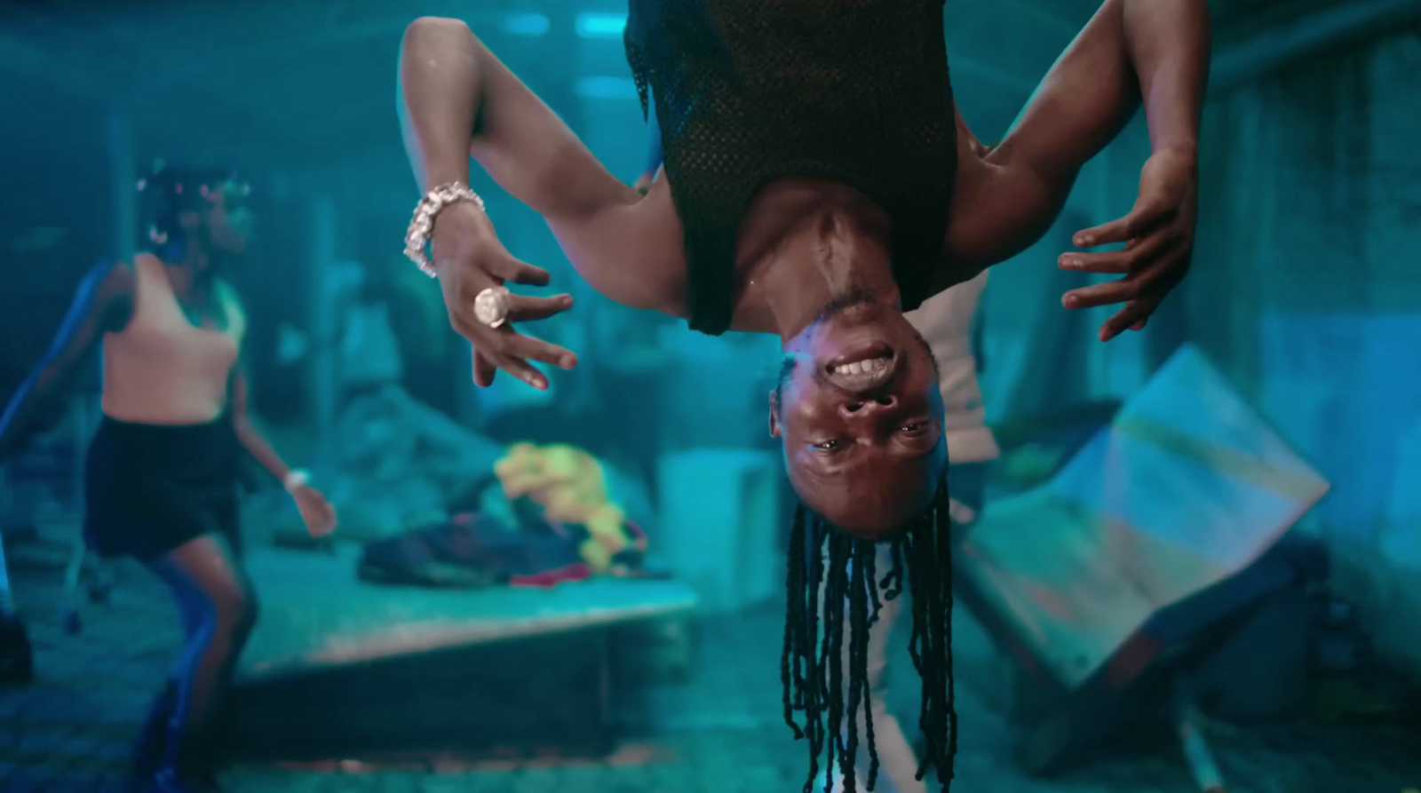 a woman hanging upside down in a room