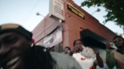 a group of people standing outside of a building