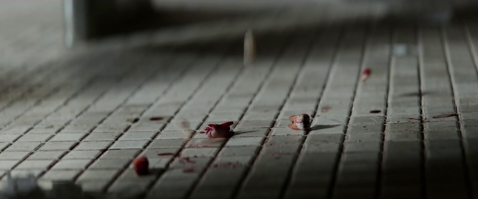 a close up of a floor with blood on it