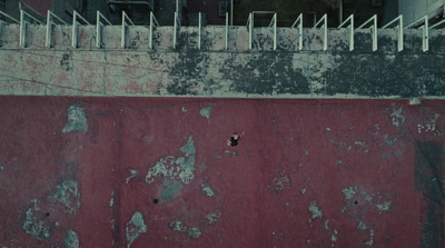 a man riding a skateboard down the side of a ramp