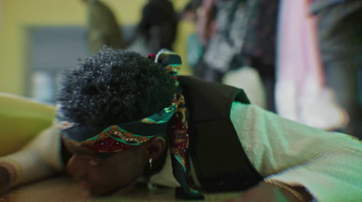 a close up of a person wearing a head band