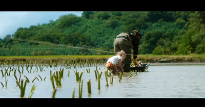 a man standing on a boat in the water