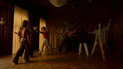 a group of people dancing in a dark room