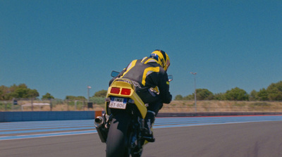 a person riding a motorcycle on a race track