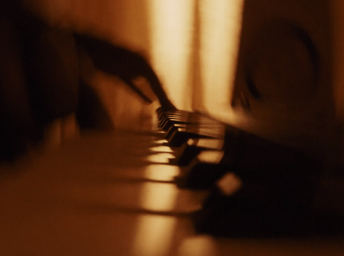 a blurry photo of a piano keyboard